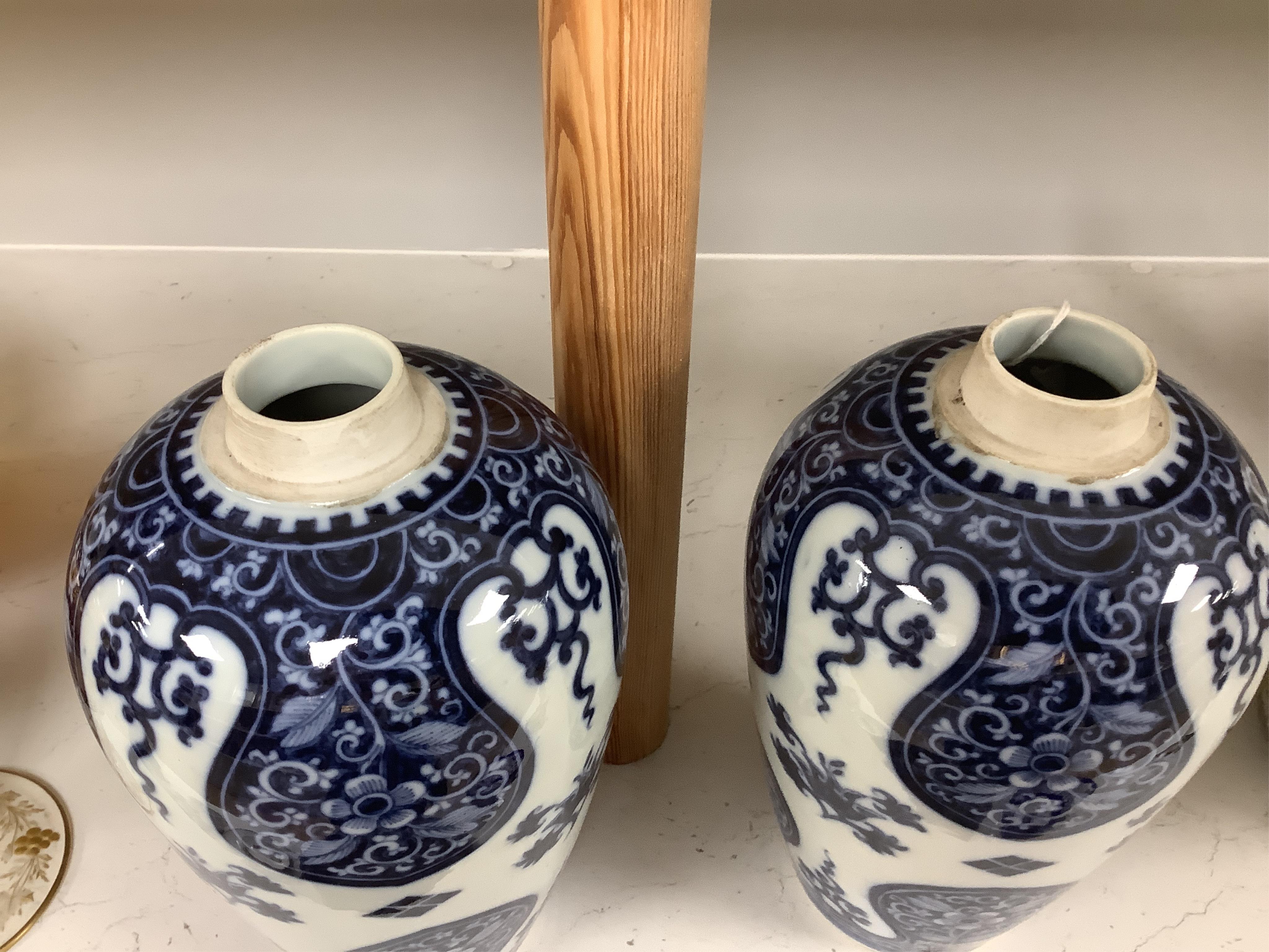 A pair of Samson of Paris blue and white vases, in Kangxi style 23cm high. Condition - good